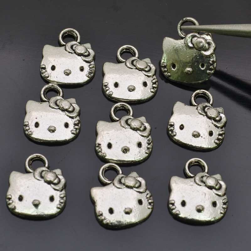 Charms a forma di Hello Kitty in lega di metallo 11mm 9pz  | GDO